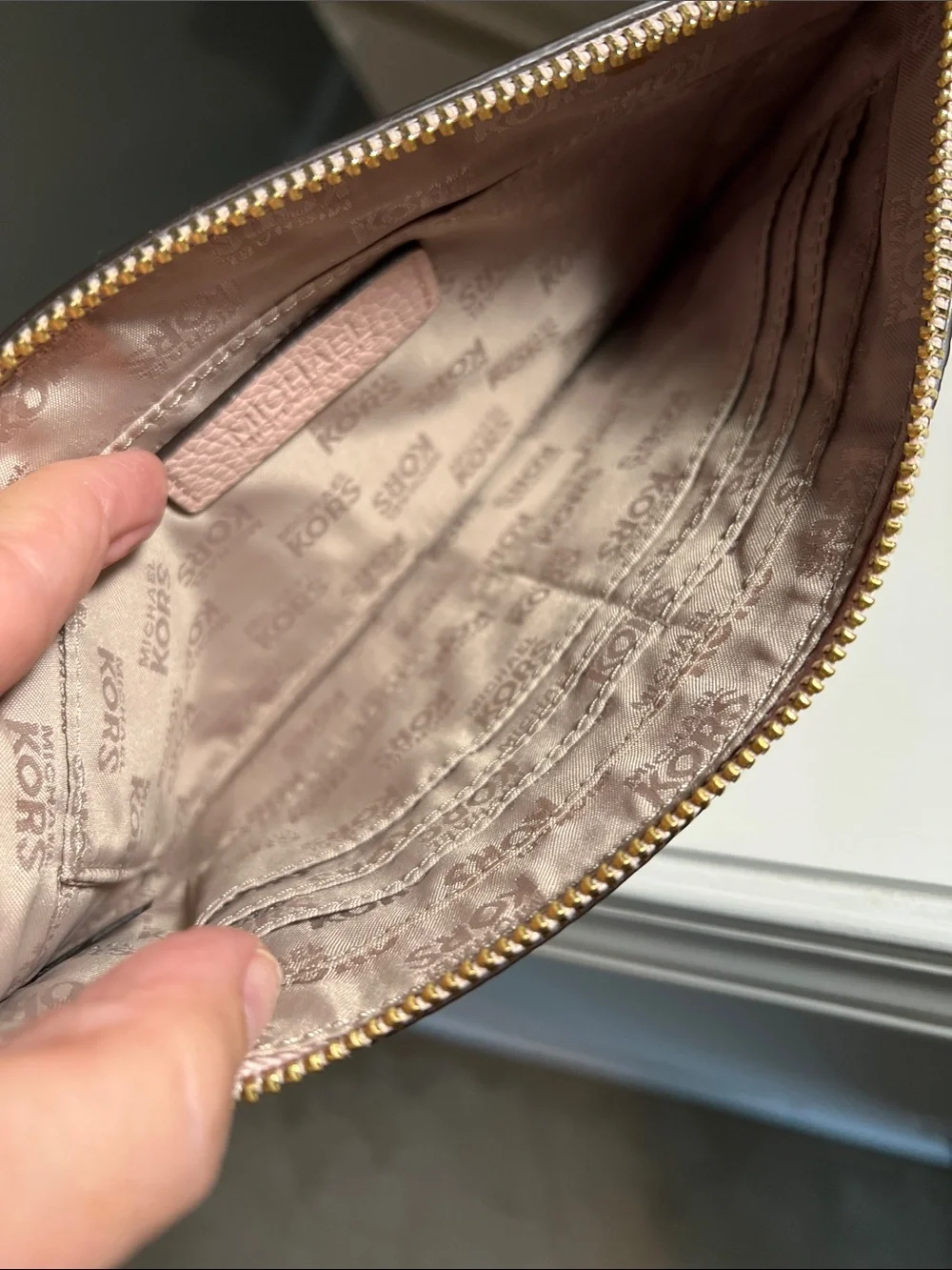 Michael Kors Blush Pebbled Leather Zip Clutch with Gold MK Logo